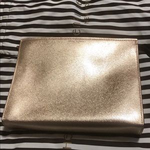 Henri Bendel Rose gold clutch